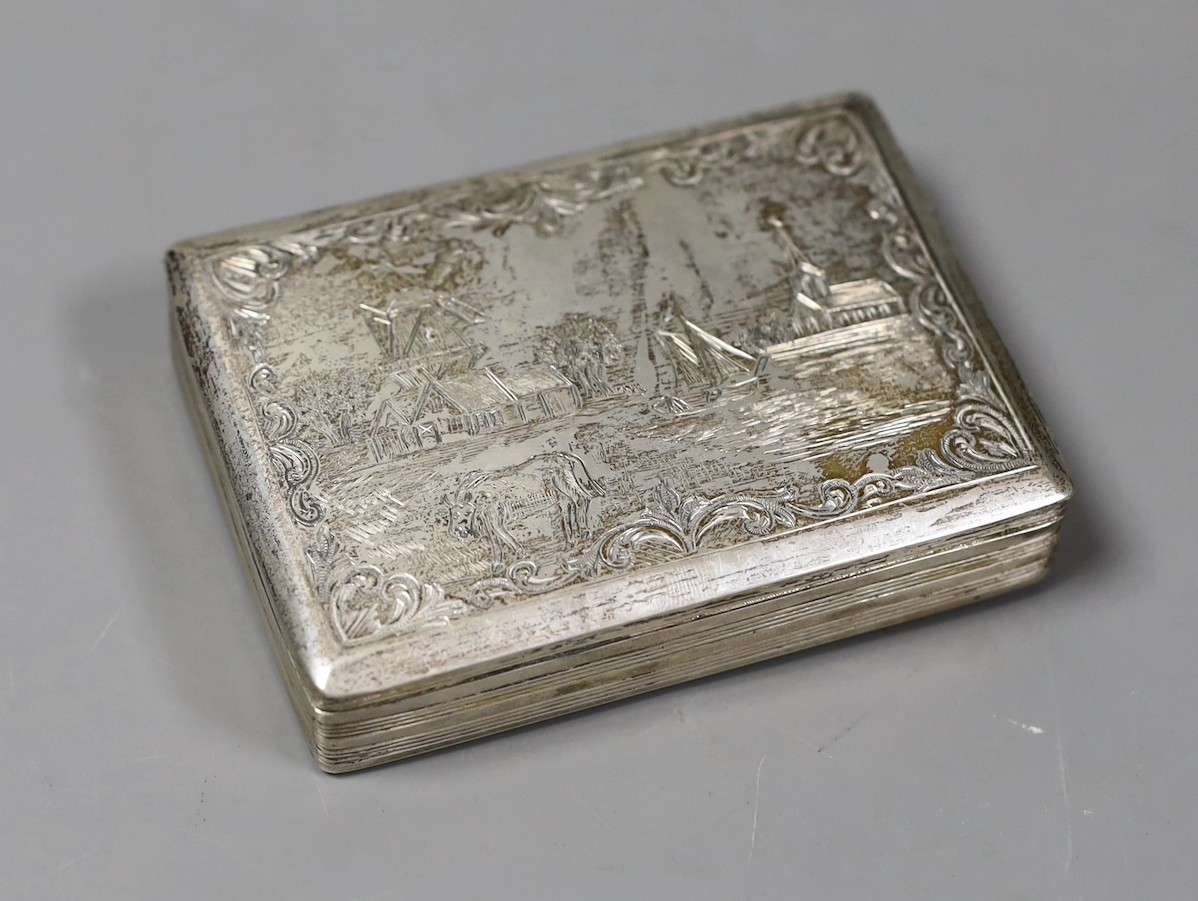 A 19th century Dutch 833 standard white metal rectangular box and hinged cover, engraved with countryside scene, 95mm, 102 grams.